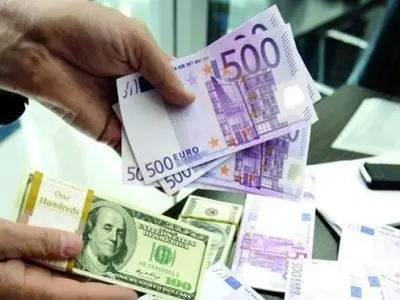 Dollar hits low note while euro shines; storms stoke worry in U.S.