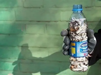 عکس: پاکسازی پارک‌های مشهد از ته سیگار 