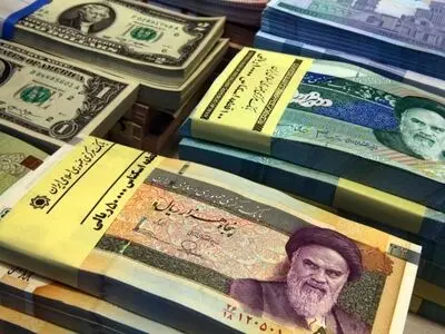 Iran approves plan to slash four zeros from currency

