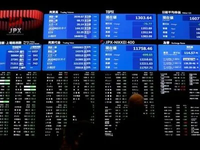 Asian shares hit one-year high, dollar slips on weaker U.S. data