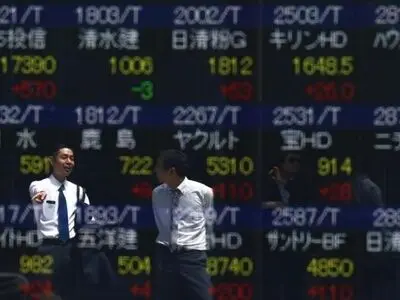 Asia stocks fall in Wall Street's wake, dollar holds below 14-year peak