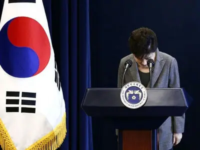 South Korean court throws president out of office, two dead in protest