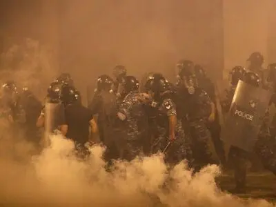Beirut police fire tear gas as protesters regroup and two ministers quit
