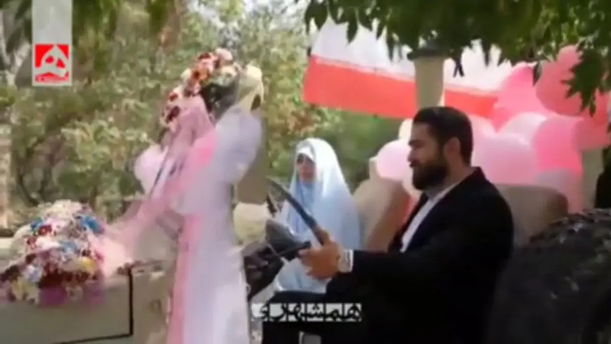 تصاویری از خودرو نظامی گل زده برای مراسم جشن «زوج‌های جان‌فدا» + فیلم