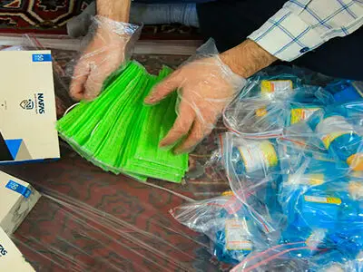 توزیع بسته های غذایی و بهداشتی میان مددجویان کمیته امداد کاشان
