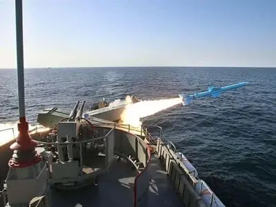 Iran launches cruise missile from submarine during drill