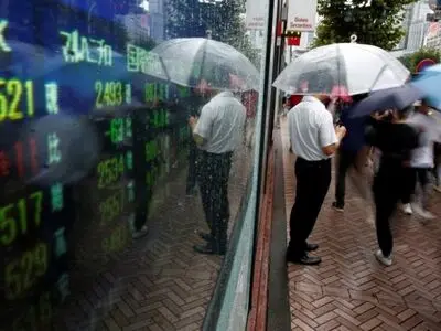 Asia shares reach record, Nikkei restrained by lockdown risk