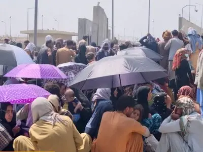 Chaos and violence as crowds keep growing outside Kabul airport