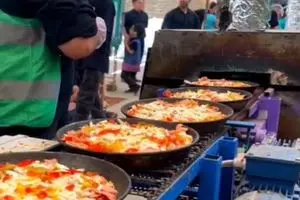 توزیع ۸ هزار پیتزا نذری در اصفهان به مناسبت تاسوعای حسینی + فیلم