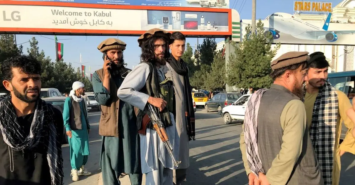 Taliban impose some order around Kabul airport - witnesses