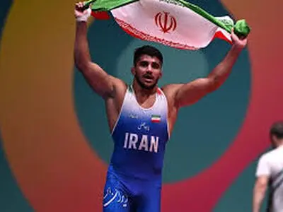 قهرمان کشتی جهان: اعتراض حق است ولى توهین به مقدسات دشمنی است + عکس