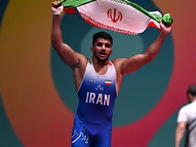 قهرمان کشتی جهان: اعتراض حق است ولى توهین به مقدسات دشمنی است + عکس