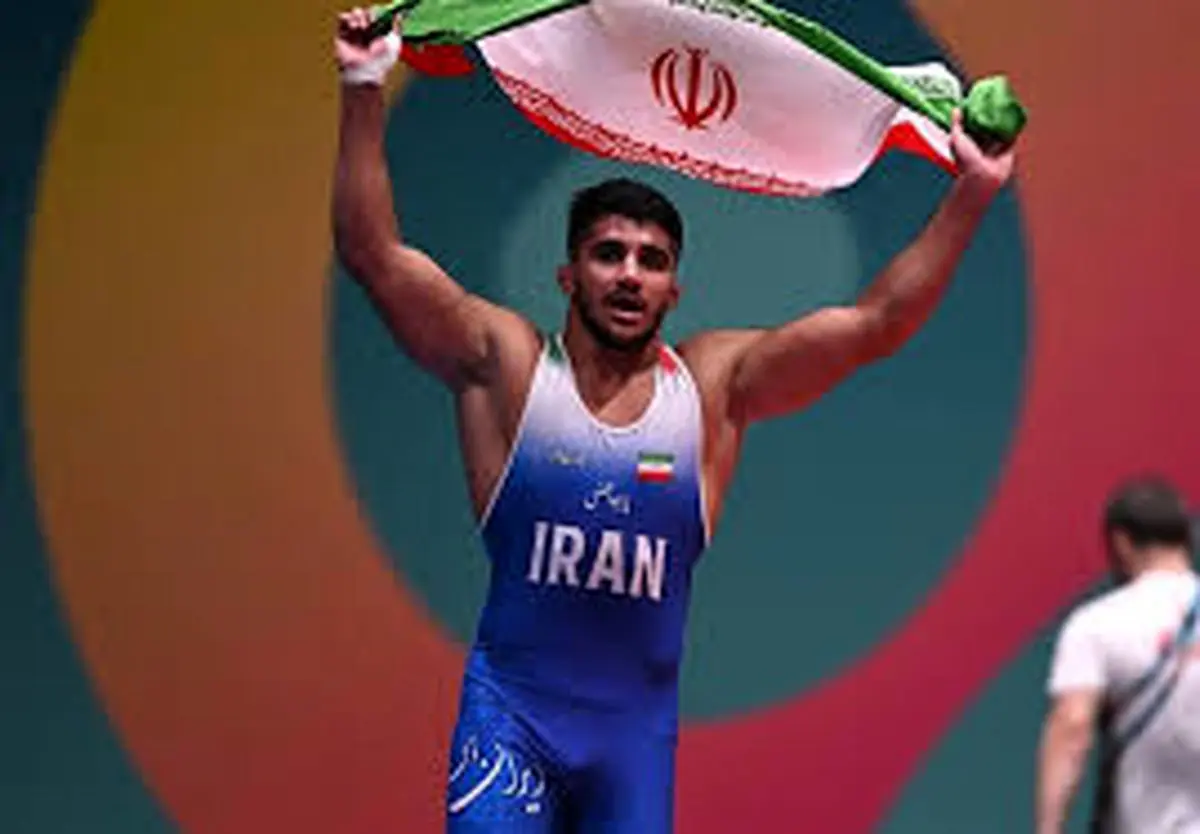 قهرمان کشتی جهان: اعتراض حق است ولى توهین به مقدسات دشمنی است + عکس